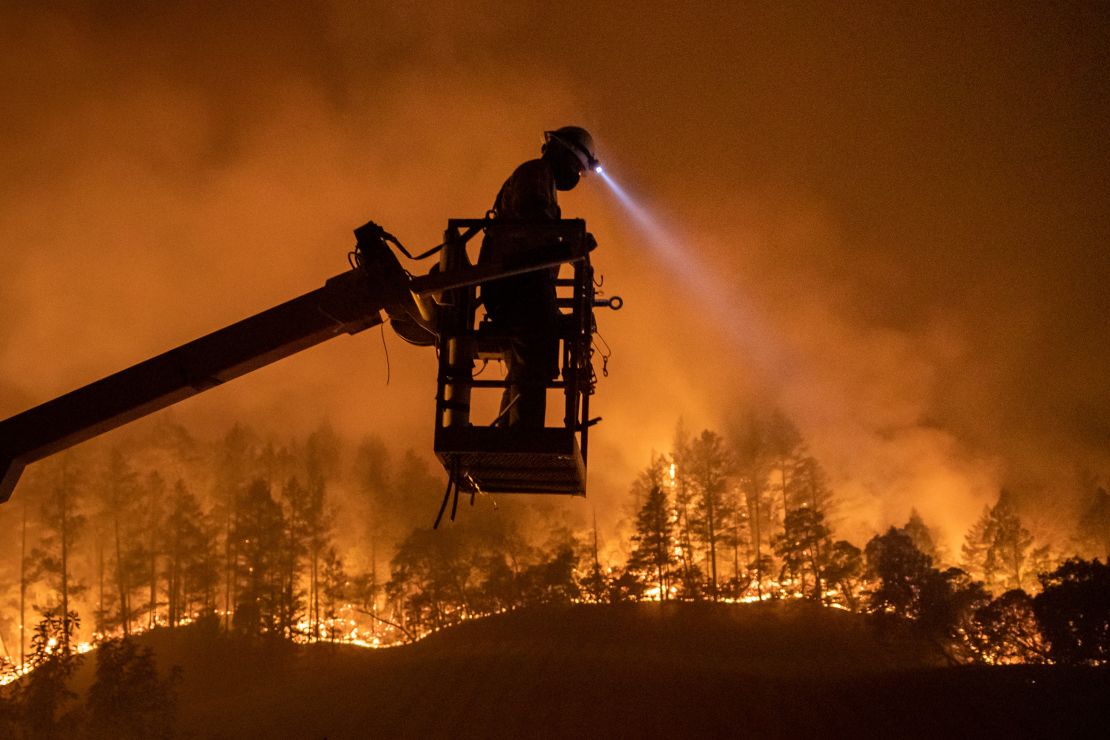 The Glass Fire burns in Calistoga, California on September 28, 2020. An unprecedented fire season in the American West in 2020 was just one of an onslaught of climate-related disasters that have swept the country in recent years.