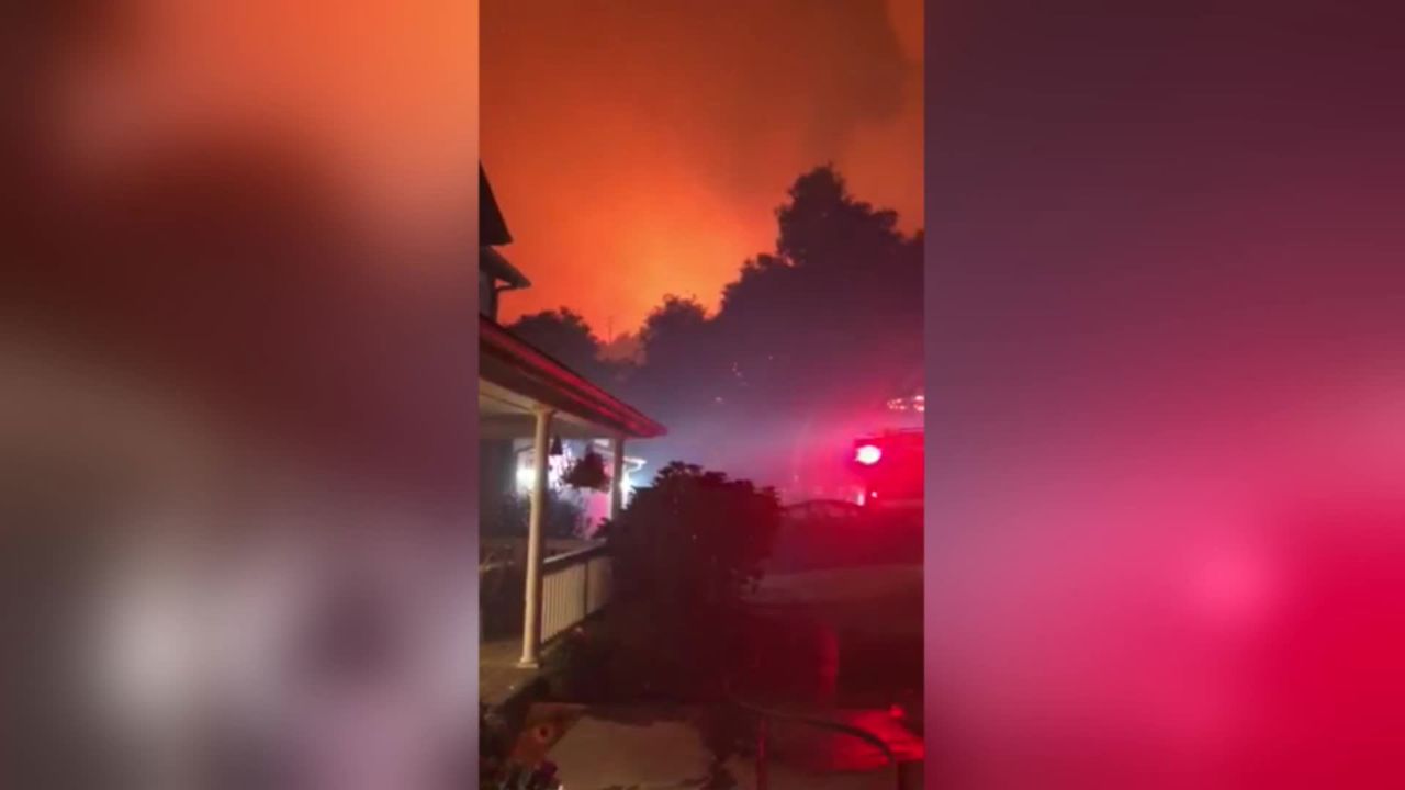 Firefighters arrived as Grant Newnom was working to protect his girlfriend's parents' home in Santa Rosa, California.