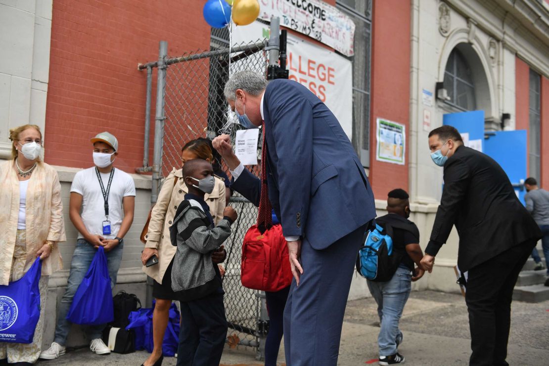 New York Mayor Bill de Blasio visits Public School 188 in Manhattan Tuesday as elementary schools reopen.