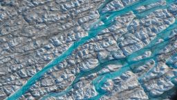 ILULISSAT, GREENLAND - AUGUST 04: In this view from an airplane rivers of meltwater carve into the Greenland ice sheet near Sermeq Avangnardleq glacier on August 04, 2019 near Ilulissat, Greenland. The Sahara heat wave that recently sent temperatures to record levels in parts of Europe has also reached Greenland. Climate change is having a profound effect in Greenland, where over the last several decades summers have become longer and the rate that glaciers and the Greenland ice cap are retreating has accelerated.   (Photo by Sean Gallup/Getty Images)