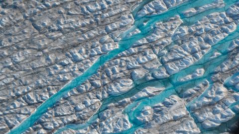 Meltwater carves into the ice sheet near the Sermeq Avangnardleq glacier in Greenland in August 2019.