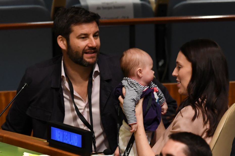 Jacinda Ardern holds her daughter Neve Te Aroha Ardern Gayford, as her partner Clarke Gayford looks on during the Nelson Mandela Peace Summit on September 24, 2018, a day before the General Debate of the General Assembly at the United Nations in New York. 