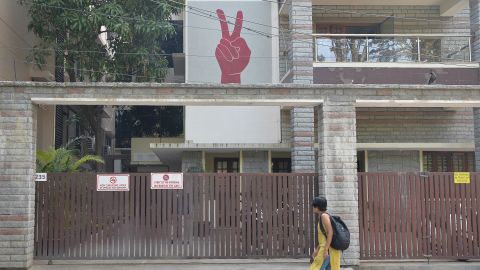 A pedestrian walks past the Amnesty International office in Bangalore on October 26, 2018, shortly after it was raided by Indian authorities.