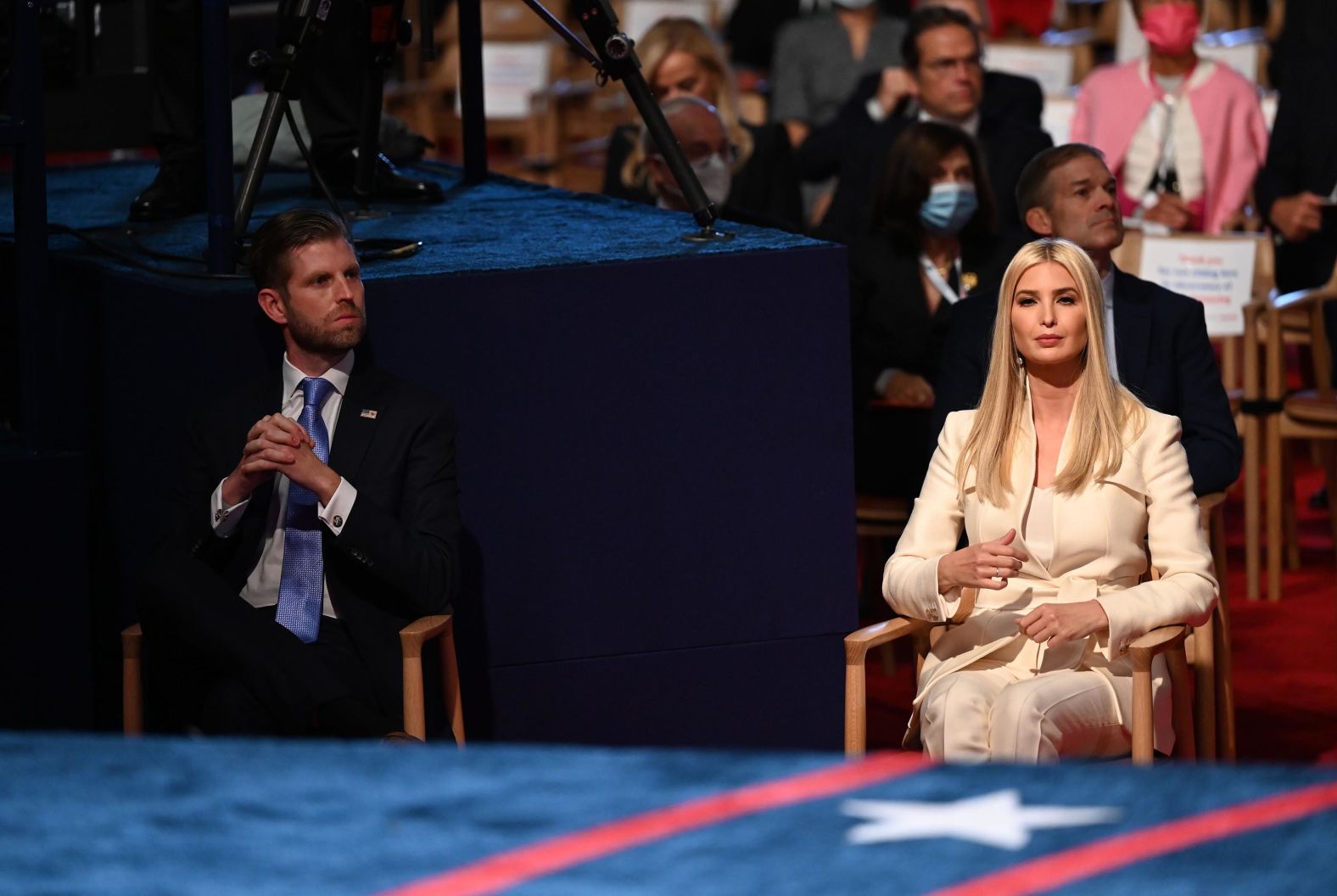 Trump's son Eric and daughter Ivanka attend the debate.