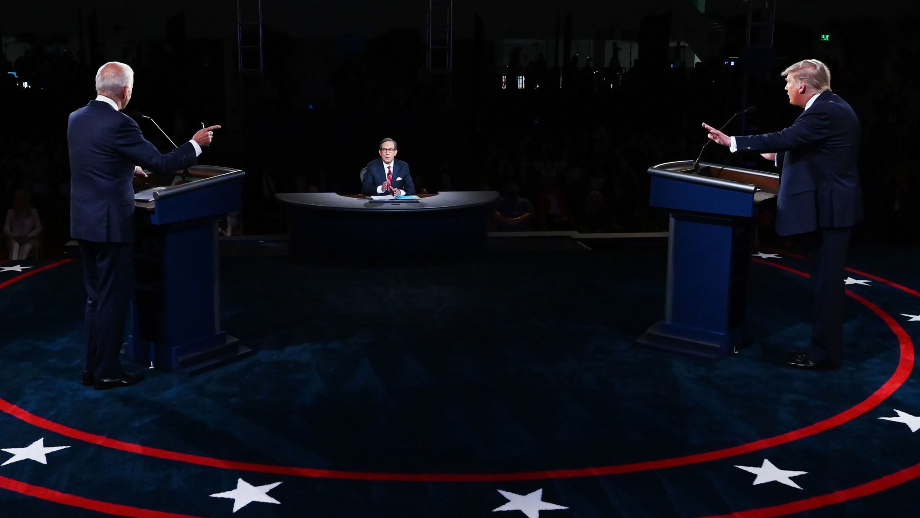 President Donald Trump, right, and Democratic nominee Joe Biden take part in the first presidential debate on Tuesday, September 29. At center is moderator Chris Wallace.