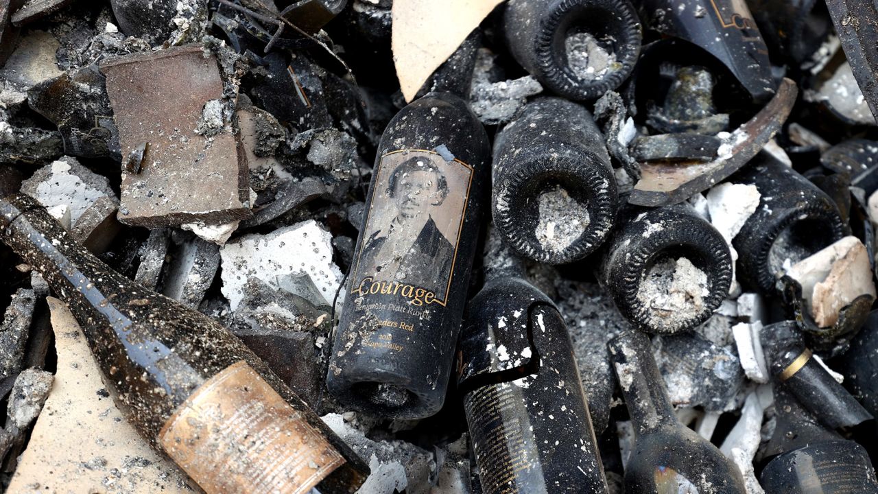 Damaged bottles of wine lay on the floor at Fairwinds Estate Winery that was destroyed by the Glass Fire.