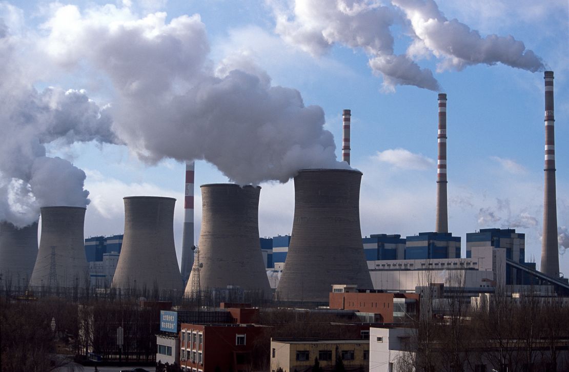 A coal-fired power plant spews steam and smoke into the air in Daqi, Inner Mongolia, China.