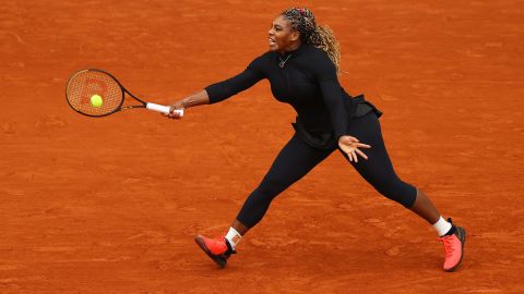 Williams plays a forehand during her first round match against Kristie Ahn.