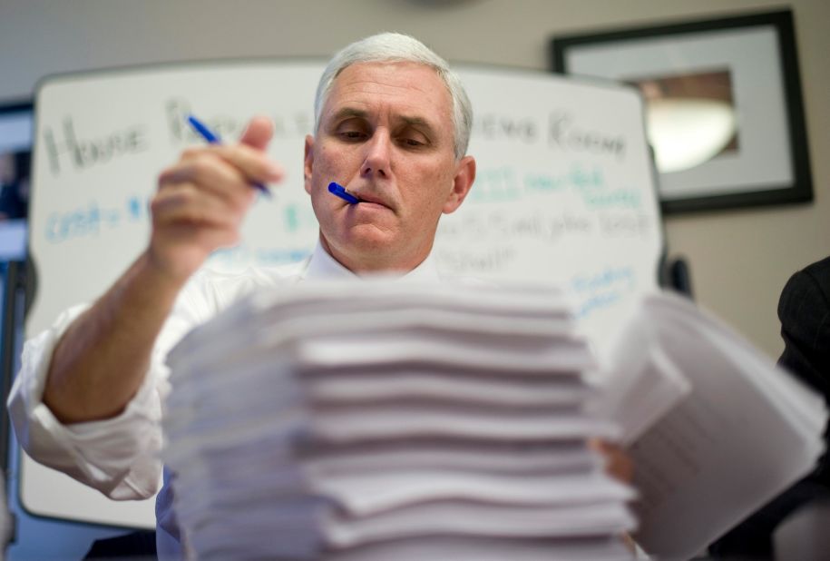 Pence makes marks on a House health-care bill in 2009.