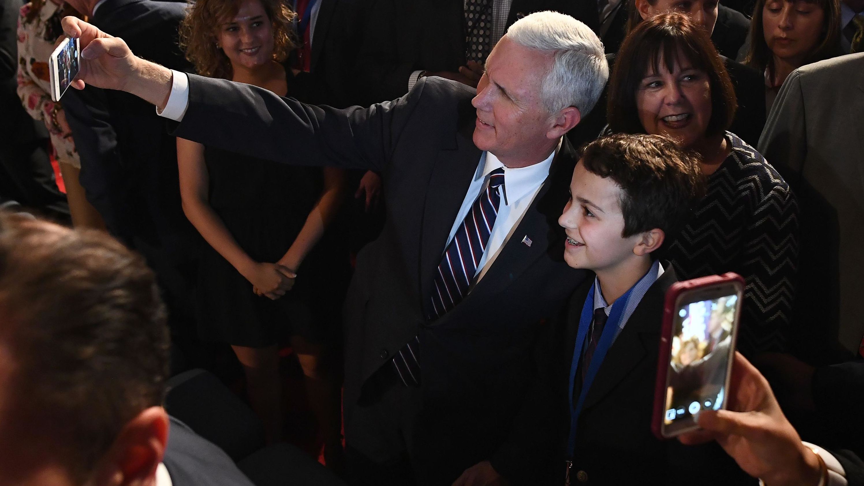 Pence takes a selfie before a presidential debate in Hempstead, New York, in September 2016.