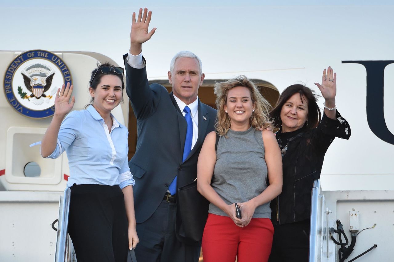 Pence and his wife are joined by their daughters Audrey, left, and Charlotte as they leave Japan in April 2017.
