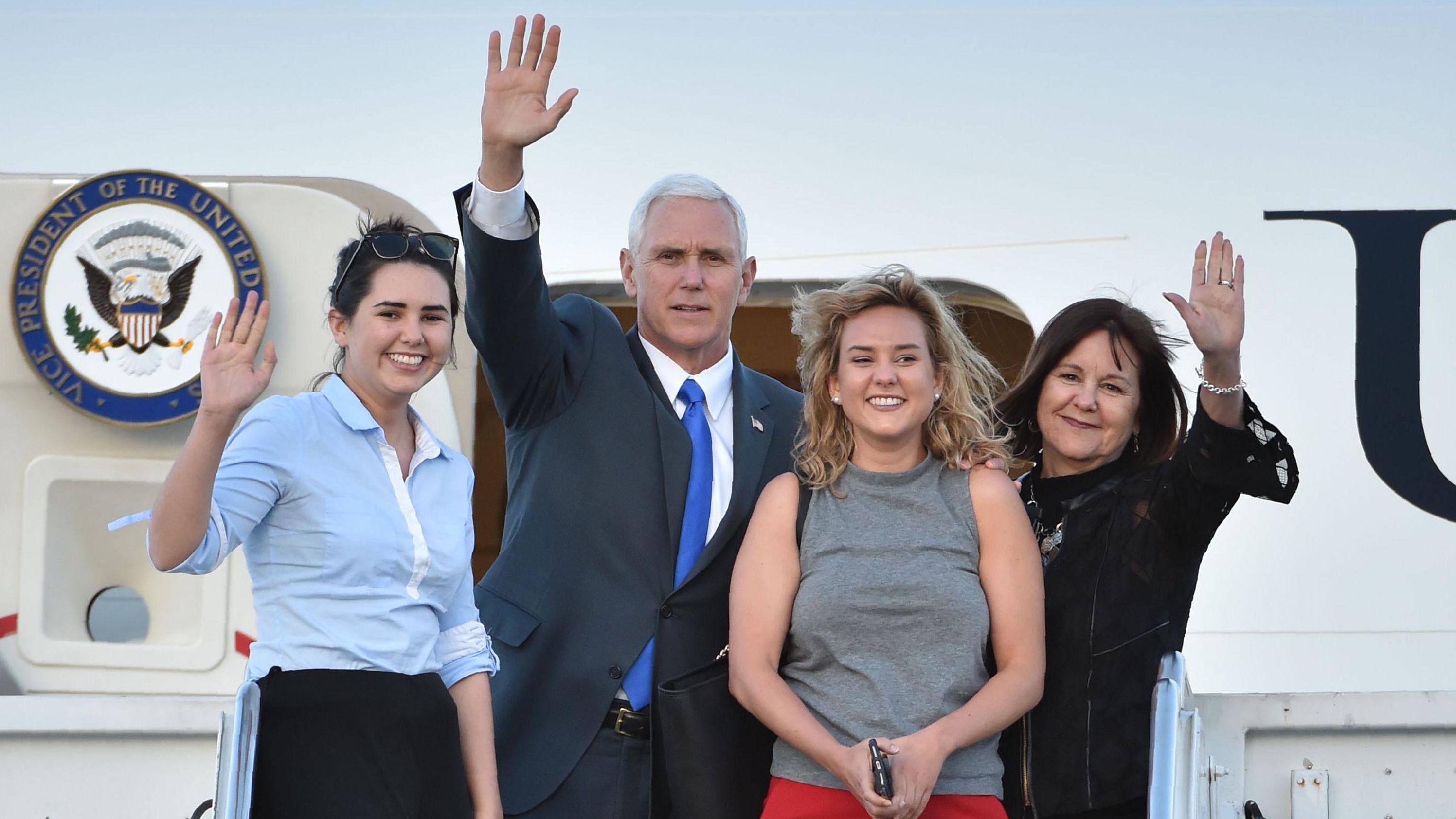 Pence and his wife are joined by their daughters Audrey, left, and Charlotte as they leave Japan in April 2017.