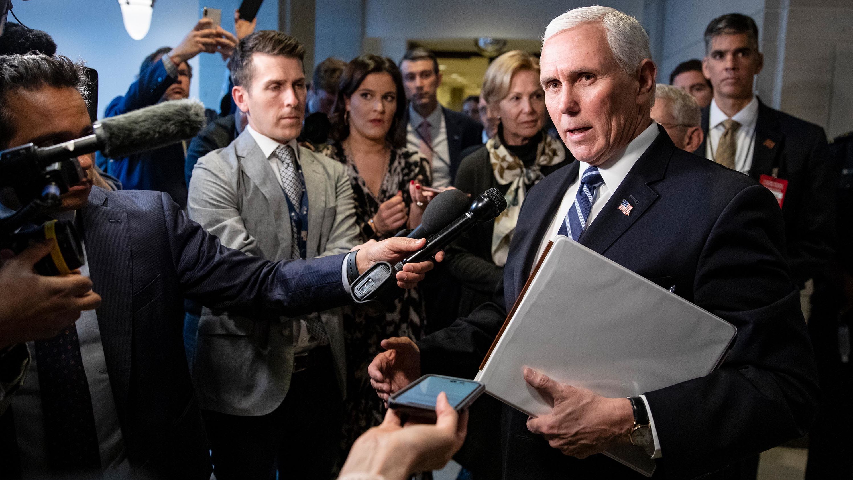 Pence stops to talk to reporters after meeting with congressional Democrats and Republicans in March 2020.