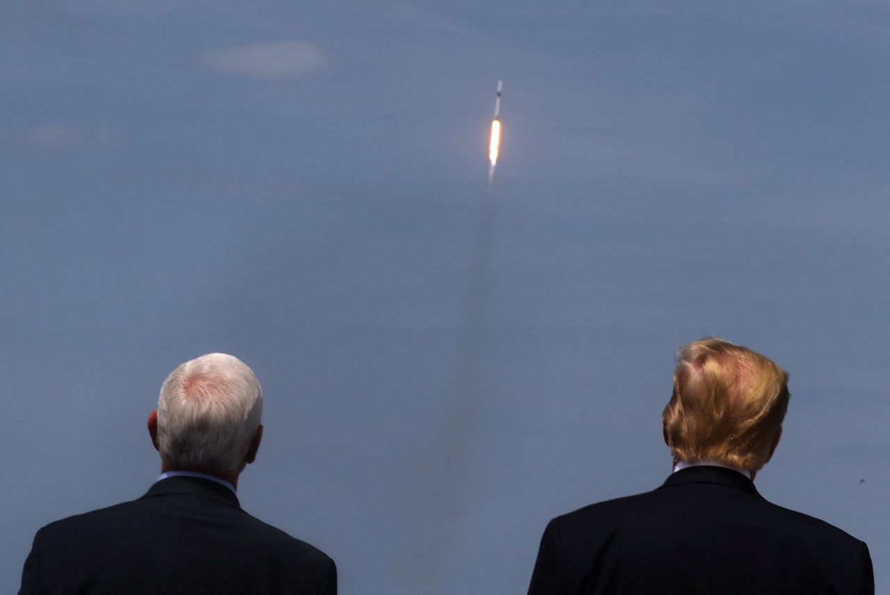 Pence and Trump watch the launch of a SpaceX Falcon 9 rocket in May 2020. It marked the first time in history that a commercial aerospace company carried humans into Earth's orbit.