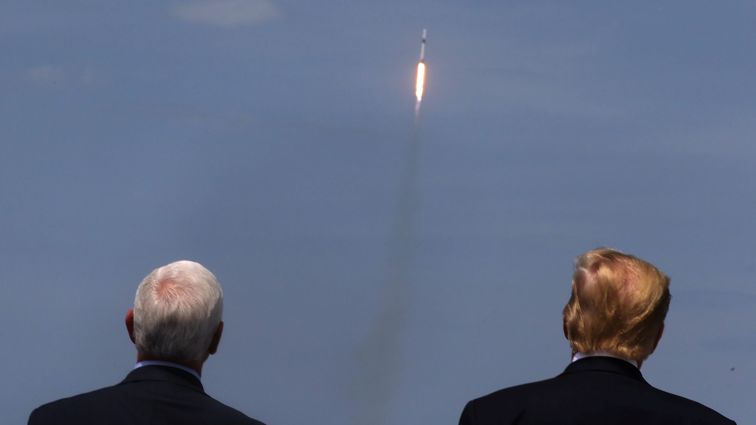 Pence and Trump watch the launch of a SpaceX Falcon 9 rocket in May 2020. It marked the first time in history that a commercial aerospace company carried humans into Earth's orbit.