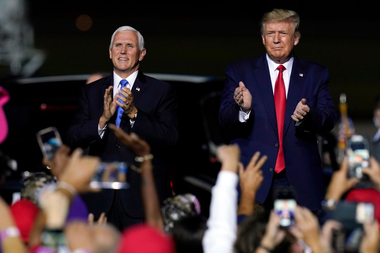 Pence and Trump arrive at a campaign rally in Newport News, Virginia, in September 2020.