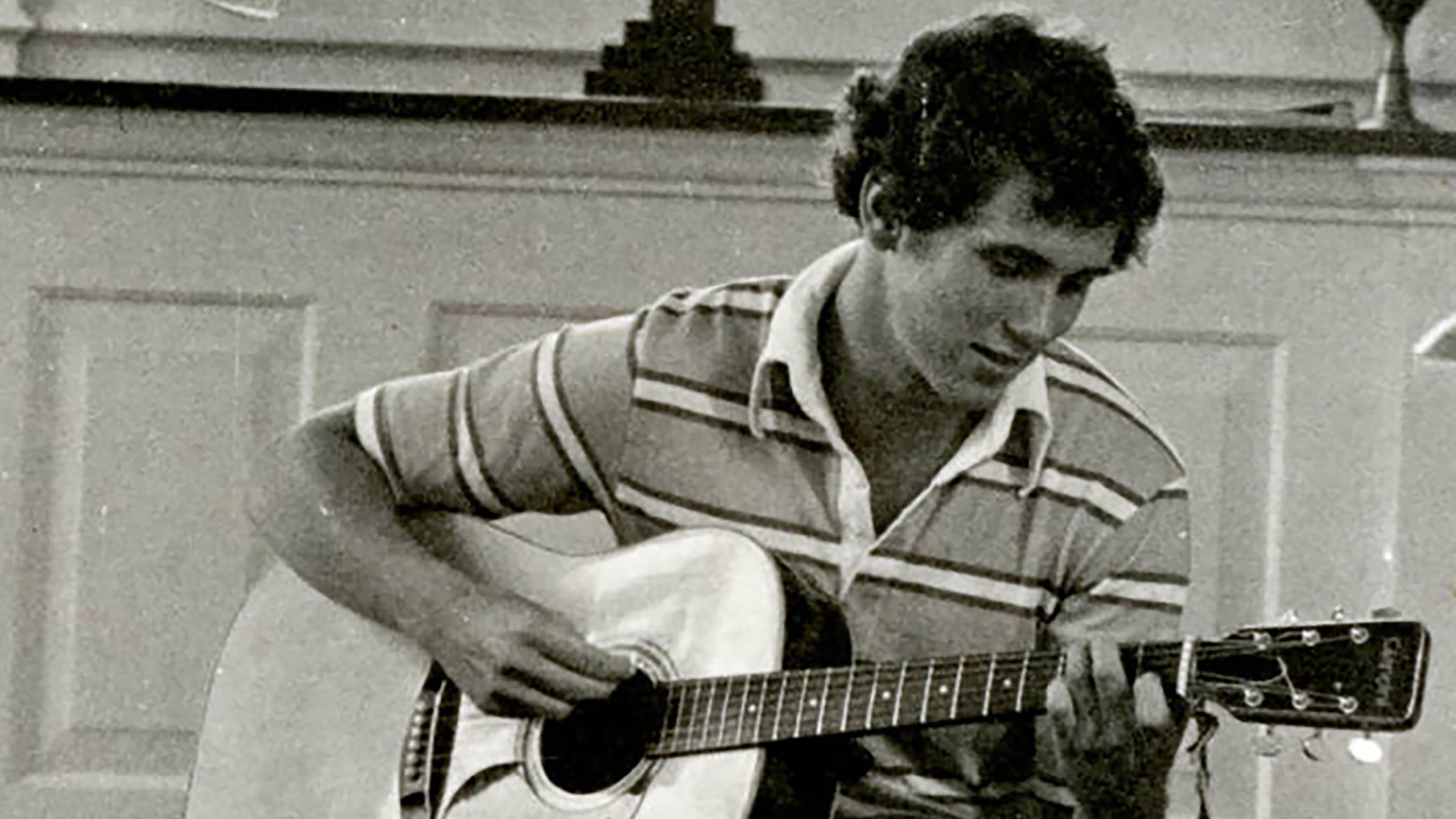 A young Pence plays guitar in a Hanover College chapel. Pence graduated from the Indiana school in 1981 and then went on to study law.