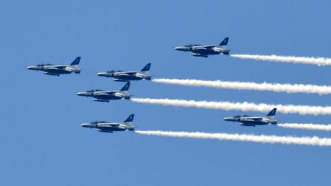 The Blue Impulse aerobatic demonstration team of Japan's Air Self-Defense Force flies over Tokyo to thank  medical workers for their efforts fighting the pandemic on May 29.