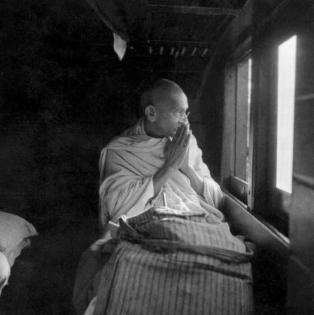 Gandhi greets people through a train window in 1940.
