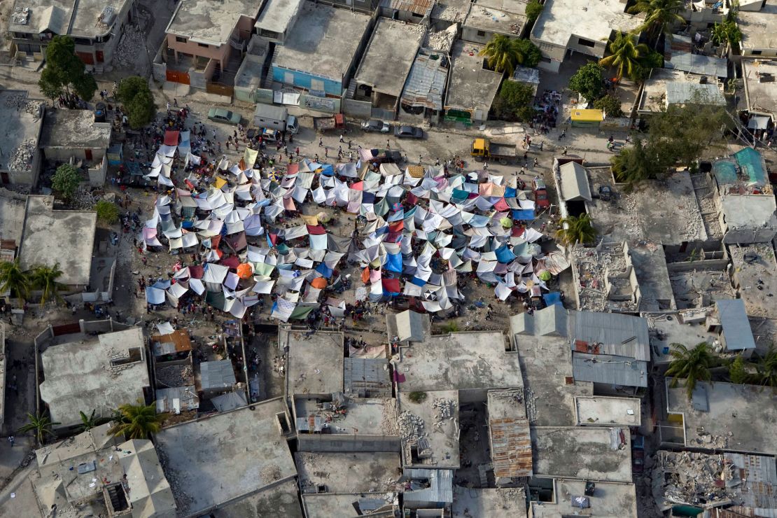 A group of tents stands amidst the rubble after an earthquake in Port-au-Prince, Haiti, on January 12, 2010, in this United Nations handout photo.