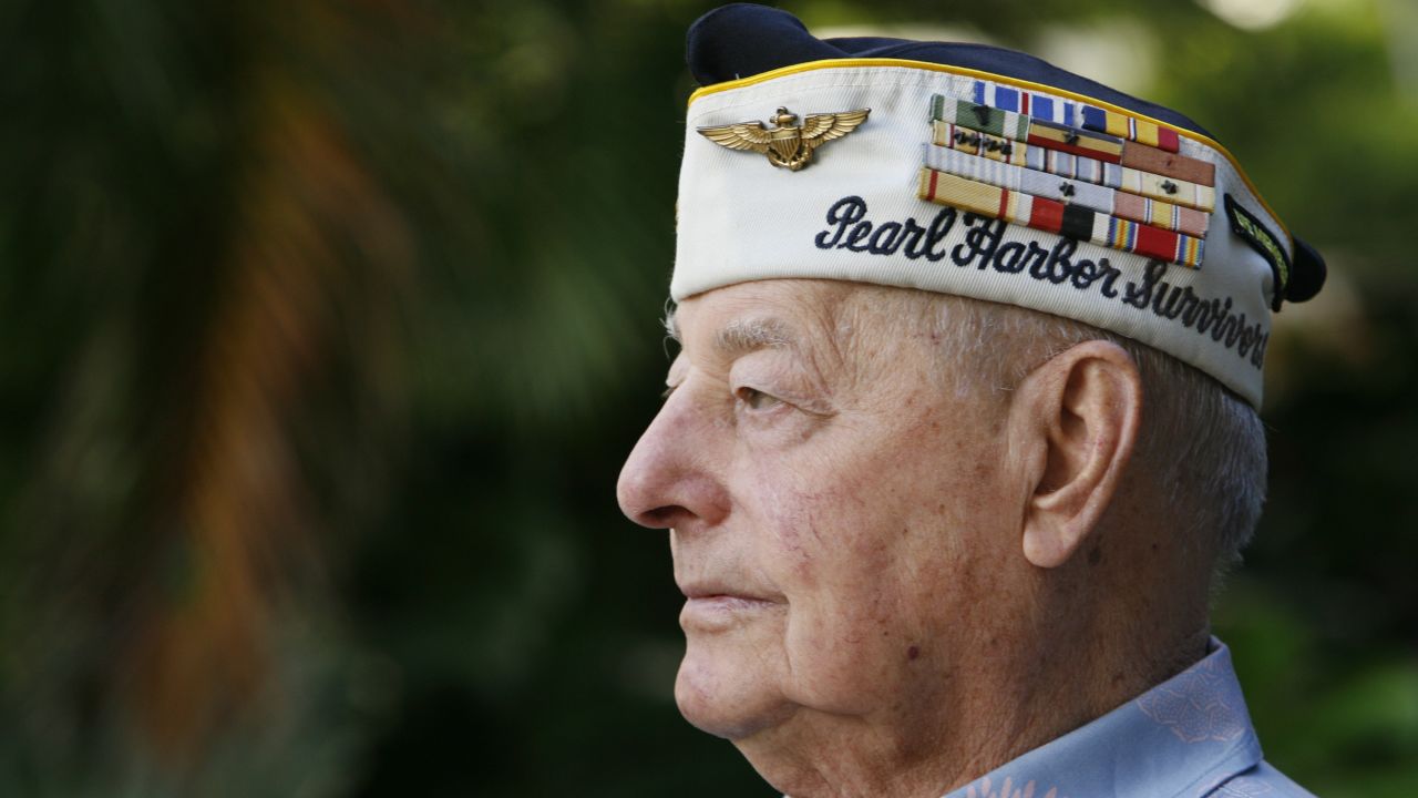 Pearl Harbor survivor Louis Conter poses for the camera at the Hale Koa hotel in Honolulu, Hawaii December 4, 2010. Navy veteran Conter was a young sailor standing watch on the quarterdeck of the USS Arizona when Japanese bombers swarmed the skies over Oahu and attacked the U.S. Pacific fleet at Pearl Harbor on December 7, 1941. This year's 69th anniversary coincides with the dedication of a new $56 million Pearl Harbor visitors center, featuring indoor and outdoor galleries, interactive exhibits, two movie theaters, an amphitheater and an education center. Picture taken December 4, 2010.  REUTERS/Hugh Gentry(UNITED STATES - Tags: ANNIVERSARY POLITICS SOCIETY)