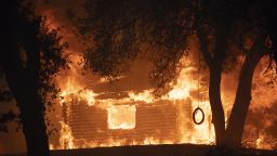 A house is seen burst into flames during the Zogg fire near the town of Igo in Shasta County, California, U.S., on Sunday, Sept. 27, 2020. In Shasta County, the new, fast-spreading Zogg fire burned 7,000 acres by Sunday evening, prompting evacuations, according to the San Francisco Chronicle. Photographer: Go Nakamura/Bloomberg via Getty Images