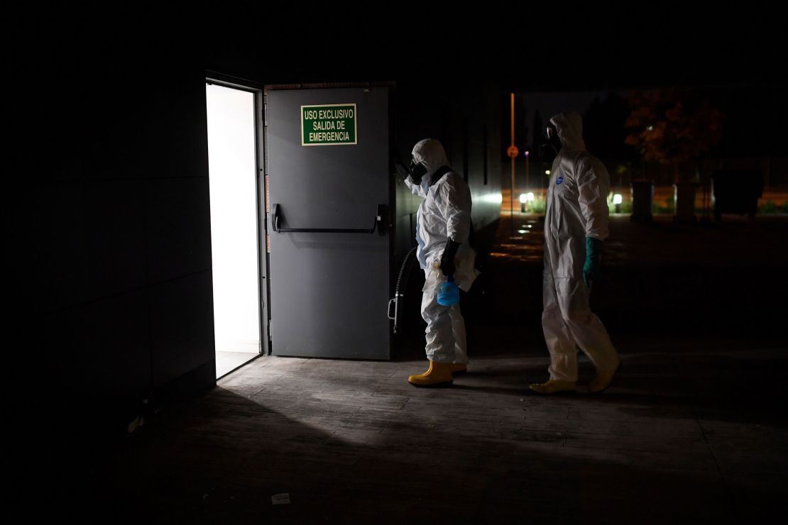Members of the Spanish Military Emergencies Unit (UME) prepare to disinfect the Lope de Vega Cultural Center in the Vallecas neighborhood of Madrid.