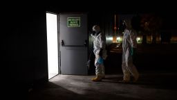 Members of the Spanish Military Emergencies Unit (UME) prepare to disinfect the Lope de Vega Cultural Center in the Vallecas neighborhood of Madrid, as cases soared in the capital.