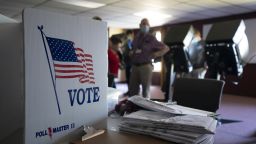 An American flag is displayed on a privacy voting screen at a polling station during a power outage in Manhattan, Kansas, U.S., on Tuesday, Aug. 4, 2020. Kansas Republican voters on Tuesday will resolve a raucous Senate primary that includes a congressman preferred by party leaders and a conservative firebrand Democrats want to see win the nomination. Photographer: Doug Barrett/Bloomberg via Getty Images