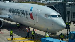 American Airlines employees check their plane after landing at La Aurora International Airport, in Guatemala City, Guatemala on Friday, September 18. The airport opens its international flight operations, and remained closed for 6 months to prevent the spread of COVID-19. During the pandemic, 84,344 people were infected and 3,076 died. (Photo by Deccio Serrano/NurPhoto via Getty Images)