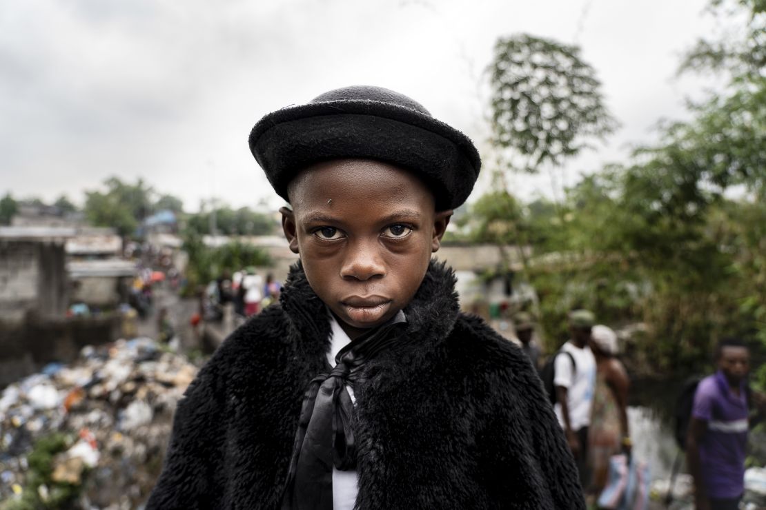 Natan Mahata, 8-year-old school student and sapeur for 3 years, in Kinshasa, 2019, captured by Tariq Zaidi