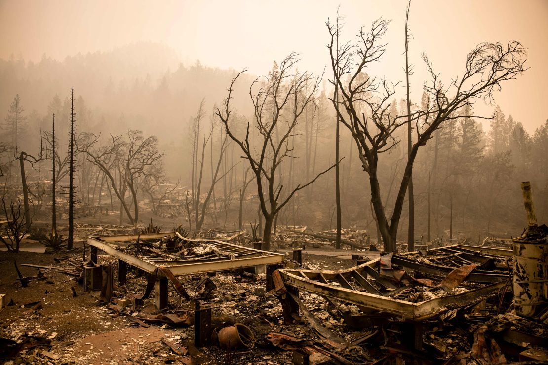 The remains of the guest houses at Calistoga Ranch smoulder after the Glass Fire on September 30, 2020.