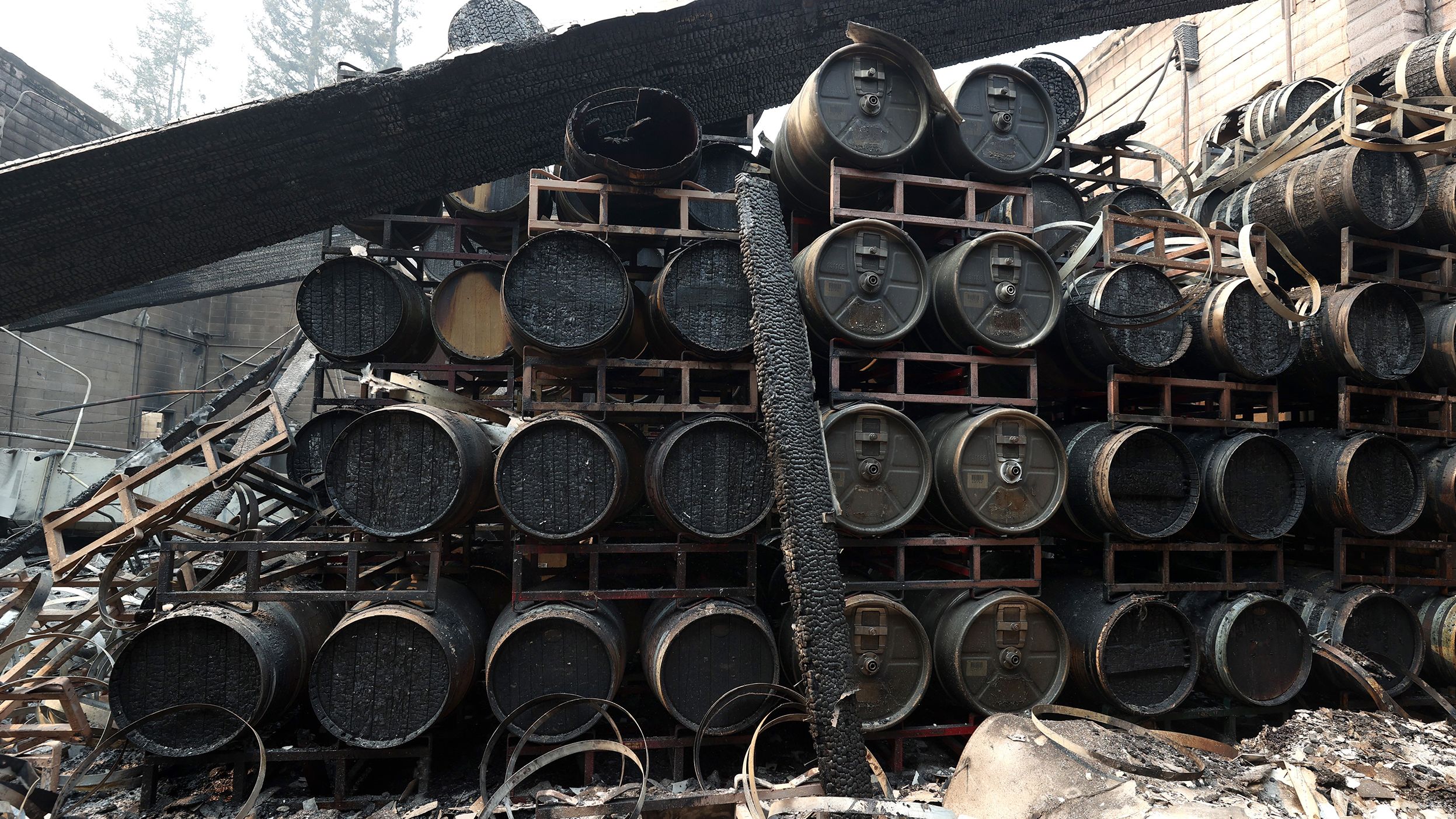 Damaged wine barrels sit stacked at the Fairwinds Estate Winery in Calistoga on September 29, 2020.