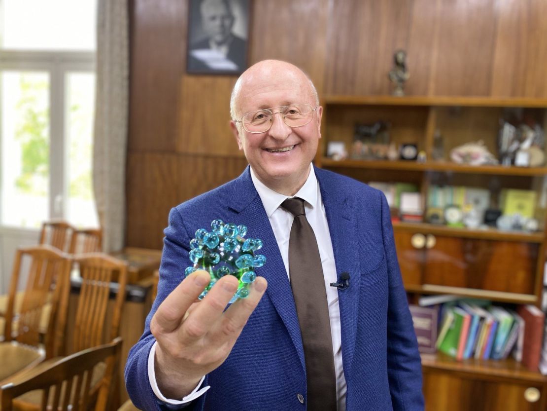 Alexander Gintsburg holds a model of the coronavirus in his office at the Gamaleya Institute. All institute staff stopped other projects to develop the vaccine, he says.