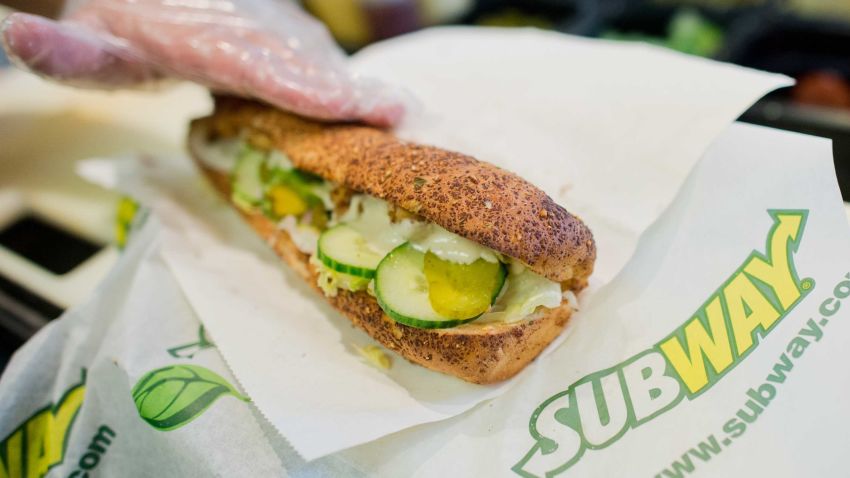 A worker prepares a sandwich inside the fast food chain Subway in Hannover, Germany, 21 August 2015. The sandwich fast food chain will celebrate its 50th birthday on 28 August 2015. Photo: Julian Stratenschulte/dpa | usage worldwide   (Photo by Julian Stratenschulte/picture alliance via Getty Images)
