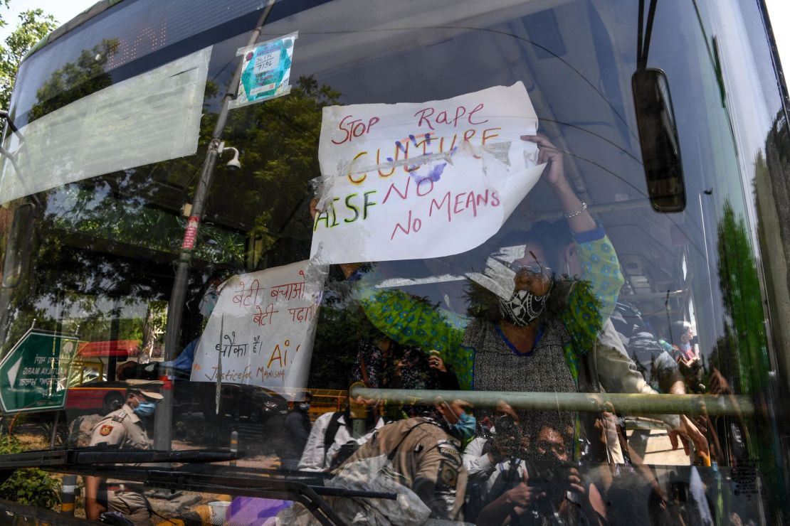 Protestors holding signs from a bus during a demonstration in New Delhi, India, on September 30, after the death of a 19-year-old woman who was allegedly gang raped. 