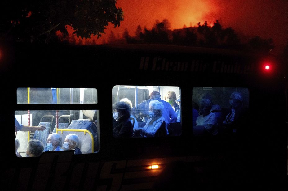 Residents of the Oakmont Gardens senior home are transported to safety as the Shady Fire approaches in Santa Rosa on September 28, 2020.