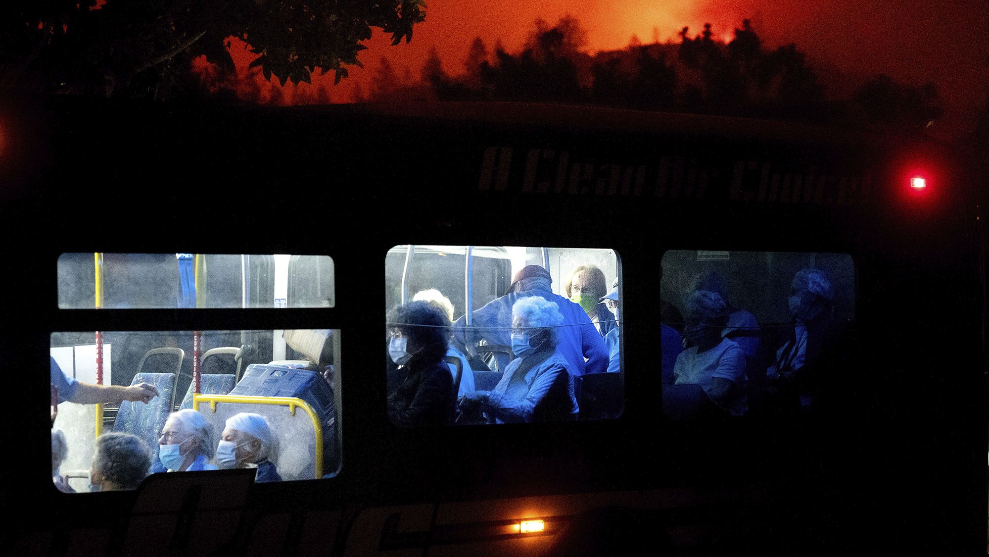 Residents of the Oakmont Gardens senior home are transported to safety as the Shady Fire approaches in Santa Rosa on September 28, 2020.