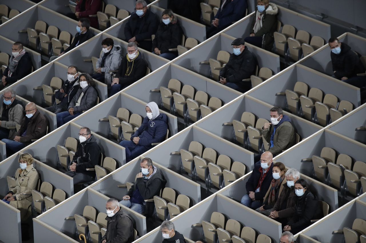 Spectators watch a French Open tennis match in Paris on September 28.