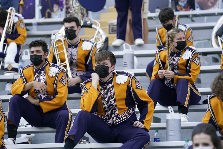 Members of the LSU marching band sit apart from one another before a college football game in Baton Rouge, Louisiana, on September 26.