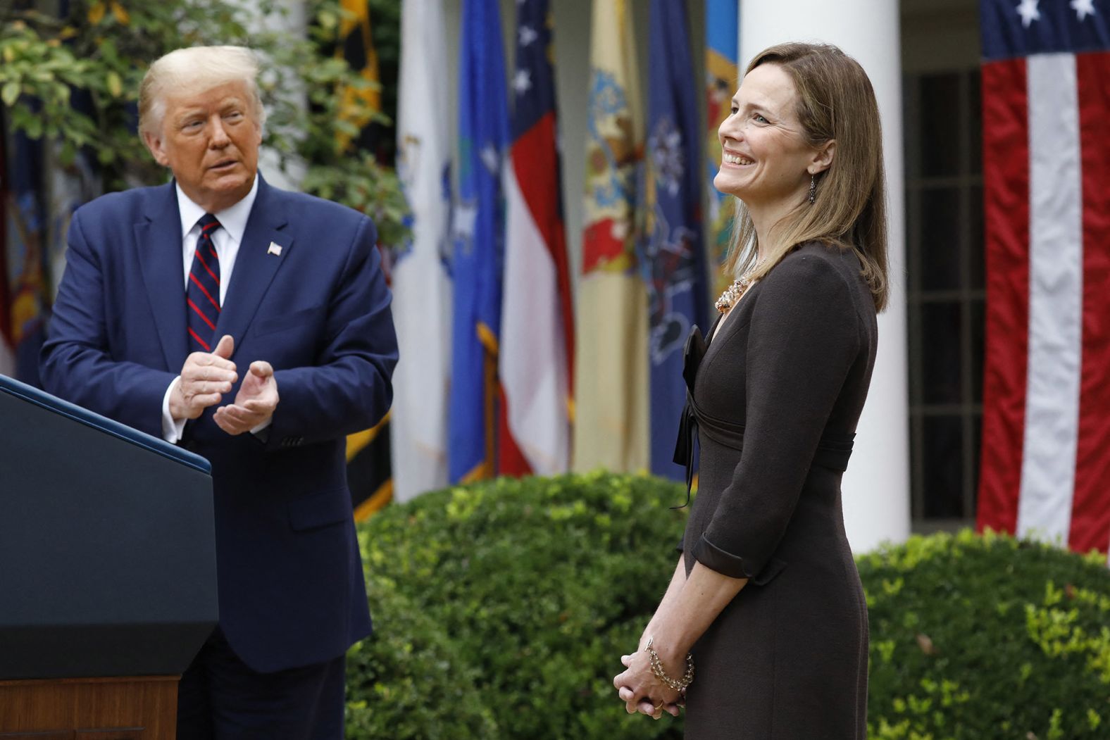 Judge Amy Coney Barrett reacts as Trump <a href="index.php?page=&url=https%3A%2F%2Fwww.cnn.com%2F2020%2F09%2F26%2Fpolitics%2Famy-coney-barrett-supreme-court-nominee%2Findex.html" target="_blank">introduces her as his Supreme Court nominee</a> in September 2020. <a href="index.php?page=&url=http%3A%2F%2Fwww.cnn.com%2F2020%2F10%2F09%2Fpolitics%2Fgallery%2Famy-coney-barrett%2Findex.html" target="_blank">She was confirmed</a> a month later by a Senate vote of 52-48.