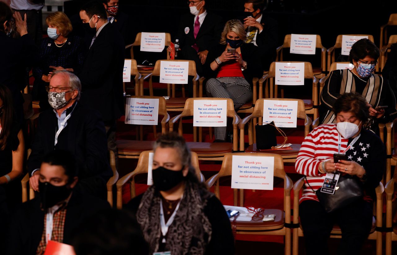 Audience members sit with chairs in between them before <a href="https://www.cnn.com/2020/09/29/politics/gallery/biden-trump-first-2020-presidential-debate/index.html" target="_blank">the presidential debate</a> in Cleveland on September 29. There was a much smaller in-person audience than usual, and everyone attending was supposed to take a Covid-19 test and follow other safety protocols.