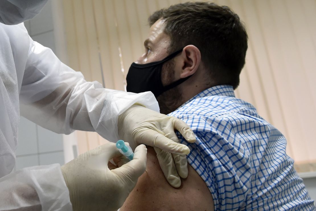 Volunteer Ilya Dubrovin, 36, gets a shot in Russia's human trials of its Sputnik V coronavirus vaccine at a clinic in Moscow in September. 