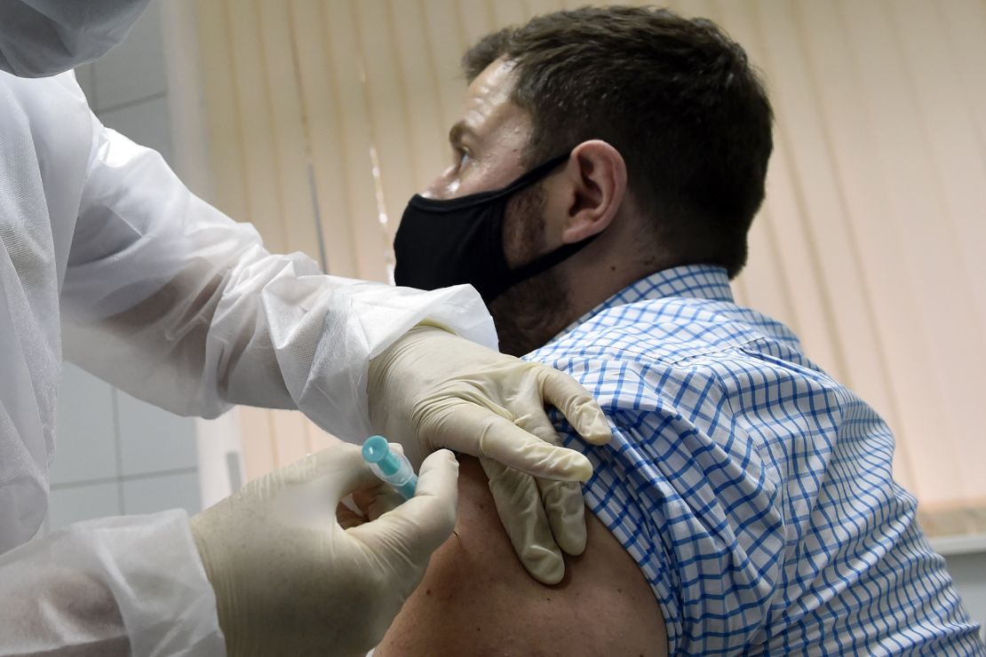 Volunteer Ilya Dubrovin, 36, gets a shot in Russia's human trials of its Sputnik V coronavirus vaccine at a clinic in Moscow in September.