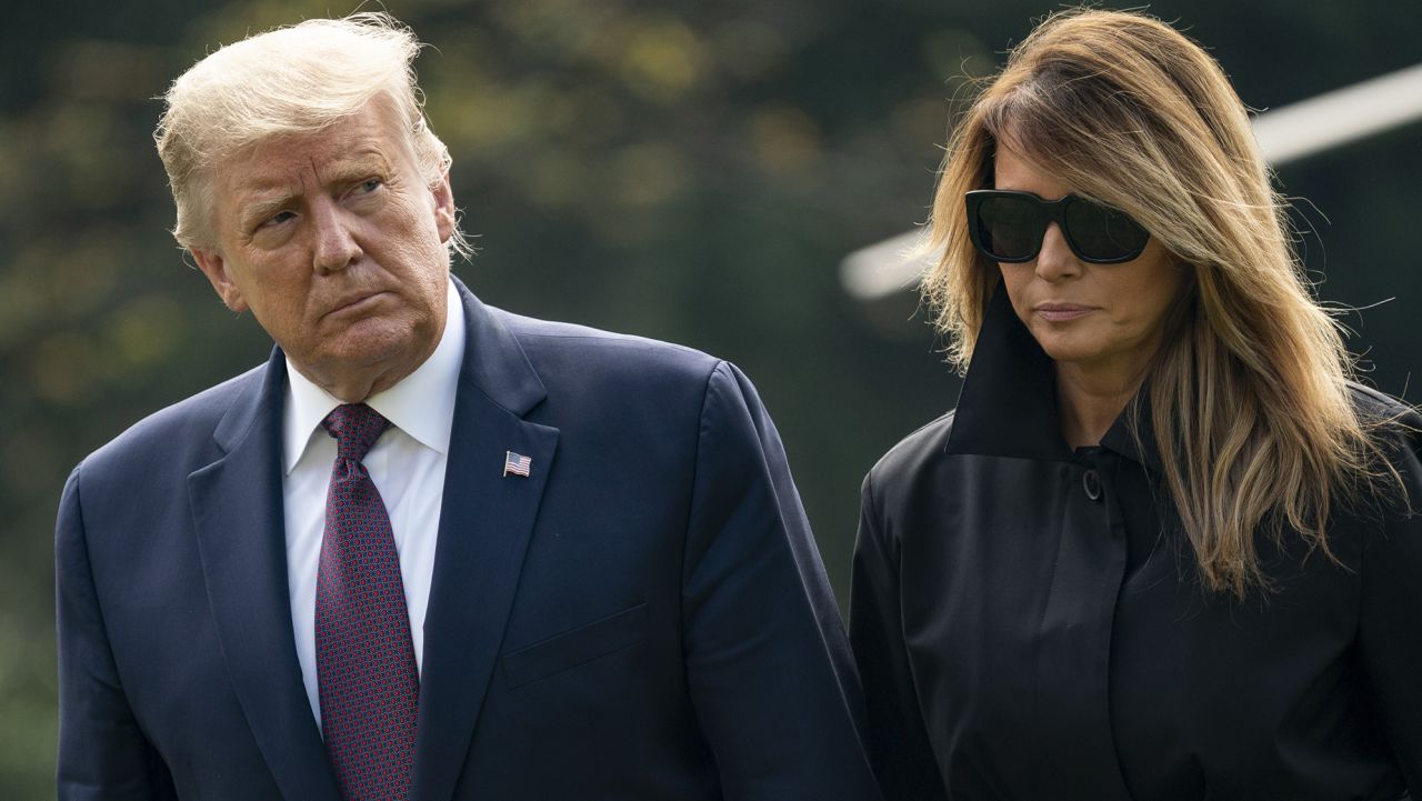 WASHINGTON, DC - SEPTEMBER 11: U.S. President Donald Trump and first lady Melania Trump walk to the White House residence as they exit Marine One on the South Lawn of the White House on September 11, 2020 in Washington, DC. President Trump and the First Lady traveled earlier to the Flight 93 National Memorial in Shanksville, Pennsylvania to mark the 19th anniversary of the September 11th attacks. (Photo by Drew Angerer/Getty Images)