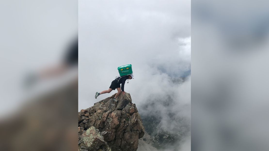 Woodrum at the peak of Mount of the Holy Cross in Colorado. 