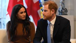 Britain's Prince Harry, Duke of Sussex and Meghan, Duchess of Sussex gesture during their visit to Canada House in thanks for the warm Canadian hospitality and support they received during their recent stay in Canada,  in London on January 7, 2020. (Photo by DANIEL LEAL-OLIVAS / various sources / AFP) (Photo by DANIEL LEAL-OLIVAS/AFP via Getty Images)