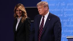 CLEVELAND, OHIO - SEPTEMBER 29:  U.S. President Donald Trump and first lady Melania Trump on stage after the first presidential debate between Trump and Democratic presidential nominee Joe Biden at the Health Education Campus of Case Western Reserve University on September 29, 2020 in Cleveland, Ohio. This is the first of three planned debates between the two candidates in the lead up to the election on November 3. (Photo by Win McNamee/Getty Images)