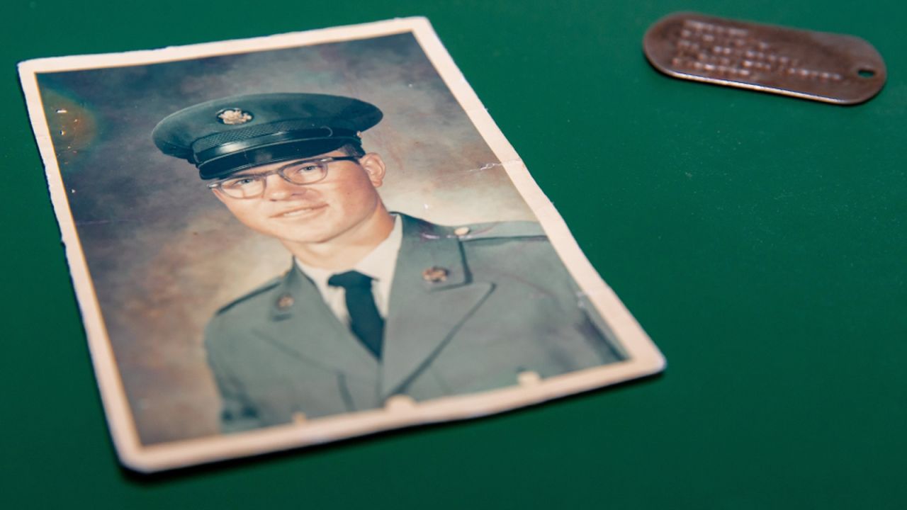 Ronald Hepper's ID tag is pictured with a photo of the Vietnam veteran and Purple Heart recipient.