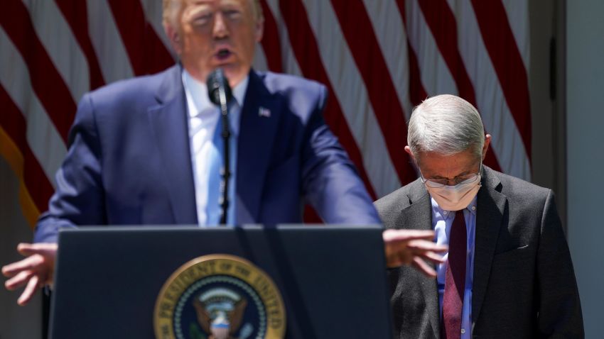 National Institute of Allergy and Infectious Diseases Director Dr. Anthony Fauci looks down as U.S. President Donald Trump speaks about administration efforts to develop a coronavirus disease (COVID-19) vaccine in the Rose Garden at the White House in Washington, U.S., May 15, 2020. REUTERS/Kevin Lamarque     TPX IMAGES OF THE DAY